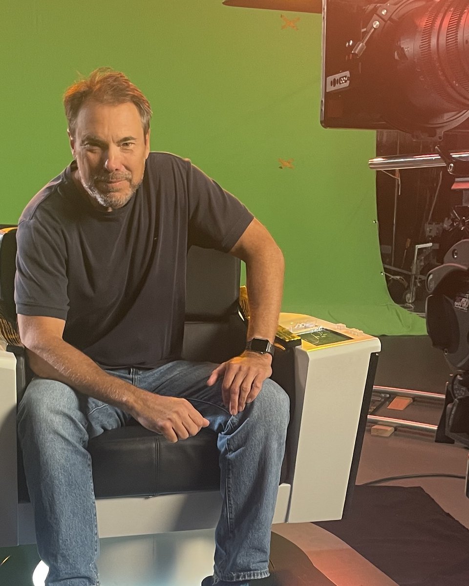 Jake Zortman on set beside a cinema camera